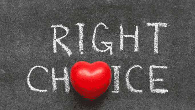 Text "RIGHT CHOICE" written in chalk on a blackboard, with a red heart shape replacing the letter "O" in "CHOICE," symbolizing a healthy or emotionally positive decision.