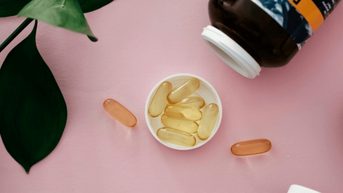 An image of two supplements and a canister on the side