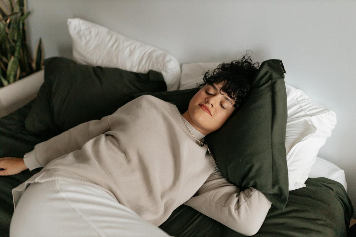 A woman takes a nap during an afternoon slump.